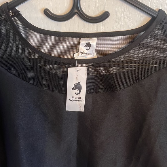 A black three quarter long sleeve women’s blouse with silk and sheer design. - Picture 3 of 7